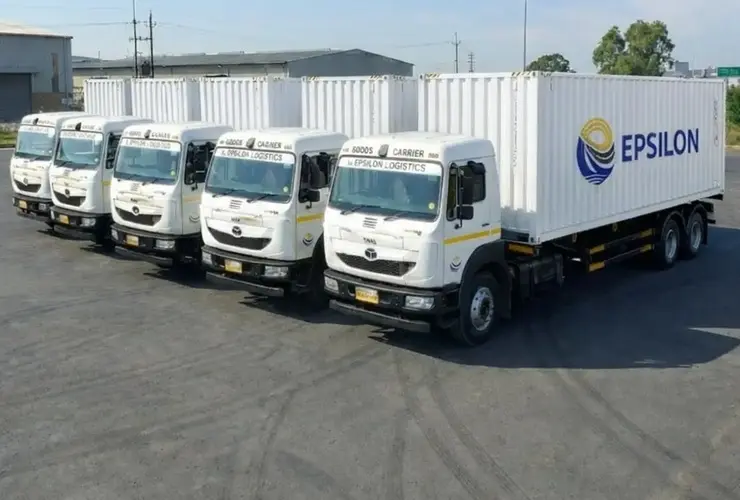 Container trucks transporting shipping containers